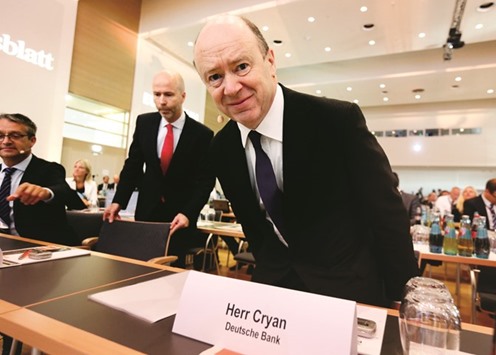 Deutsche Bank CEO John Cryan arrives at the Banks in Transition conference in Frankfurt yesterday. Cryan called for cross-border bank mergers in Europe, seeing the sectoru2019s fragmentation as placing an unacceptable squeeze on bank profits and long-term sustainability.