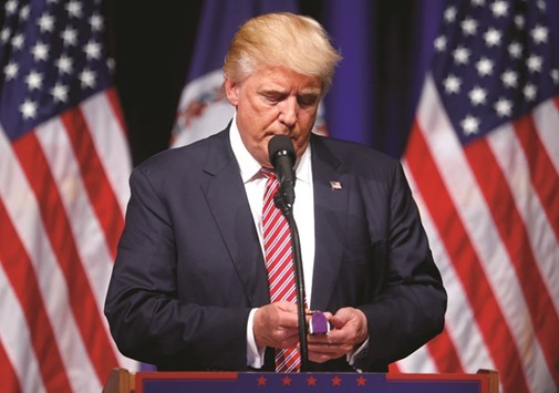 Donald Trump holds a Purple Heart given to him during a campaign event.