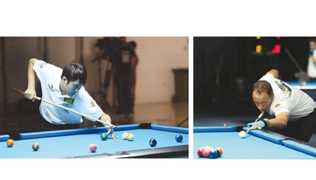 Chinese Taipei Yu Hsuan Cheng (left) and Shane Van Boening (right) of USA in action during the World 9-ball Championship at the Al Arabi Sports Club.