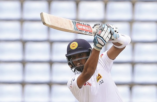 This file photograph taken on July 29, 2016 shows Sri Lankau2019s Kusal Mendis as he plays a shot during the fourth day of the opening Test match between Sri Lanka and Australia at the Pallekele International Cricket Stadium in Pallekele. Sri Lankau2019s first win over Australia in two decades proves the islanders have the talent to step into the boots of their recently retired greats, according to Test cricketu2019s most successful bowler Muttiah Muralitharan.