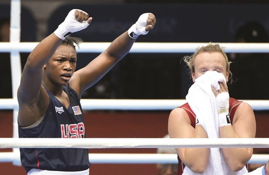 In this August 8, 2012, picture, Claressa Shields (left) of the US celebrates her win over Kazakhstanu2019s Marina Volnova in the womenu2019s boxing middleweight semi-finals at the 2012 London Olympics. (Los Angeles Times/MCT)