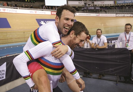In this March 6, 2016, picture, Mark Cavendish (left) and Bradley Wiggins of Britain celebrate winning the menu2019s madison final at the UCI World Track Cycling Championships in London. (Reuters)