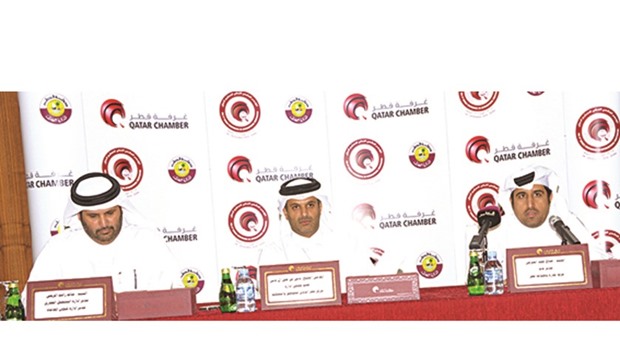 Sheikh Thani with al-Sharqi and al-Muraikhi at the QC headquerters yesterday.