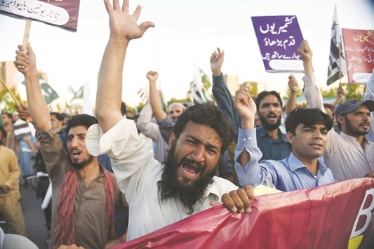 Activists from the Jamaat-ud-Dawa (JuD) shout slogans during a protest on the arrival of Indian Home Minister Rajnath Singh to attend the Saarc Home Ministersu2019 conference, in Islamabad yesterday. Indiau2019s home minister travelled to Pakistan to attend a one-day regional meeting as tensions flared between the nuclear-armed rivals over unrest in disputed Kashmir.