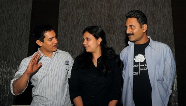 Bollywood actor Aamir Khan is seen with writer and directors Anusha Rizvi and Mahmood Farooqui (right) in this file photo taken on July 7, 2010.
