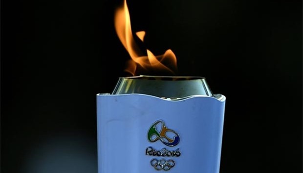 The Olympic torch is paraded through Rio de Janeiro on Thursday.