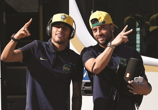 Brazilians Neymar and Felipe Anderson arrive for training.