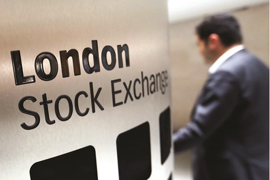 A visitor passes a sign inside the London Stock Exchange Groupu2019s headquarters. Londonu2019s FTSE 100 index, which had been wobbling beforehand, stormed up and closed 1.6% higher at 6,740.16 points.