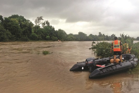 Search operations underway at the site where at least two buses with about 22 passengers were washed away in flood waters after a bridge collapse on the Mumbai-Goa Highway in Raigad.