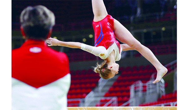 A Russian gymnast practices on the balancing beam ahead of the Olympic Games in Rio de Janeiro.