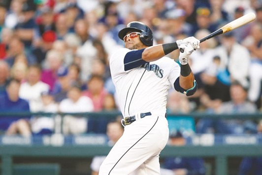 Seattle Mariners designated hitter Nelson Cruz hits a solo home run against the Boston Red Sox during the second inning at Safeco Field in Seattle on Wednesday. (USA TODAY Sports)