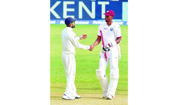 India captain Virat Kohli congratulates Roston Chase of the West Indies after his unbeaten knock of 137 helped the hosts secure a draw in the second Test at Sabina Park in Kingston, Jamaica, on Wednesday.