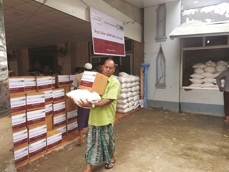 Displaced people are provided with essential food supplies by Qatar Charity.