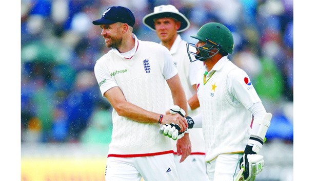 James Anderson shakes hands with Azhar Ali as rains stops play during the second day of the third Test at Edgbaston (Reuters).