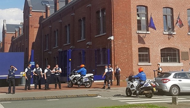 police securing the area around a police building in the southern Belgian city