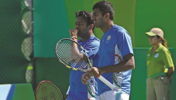 Indiau2019s Leander Paes (left) and Rohan Bopanna went down to Polandu2019s Lukas Kubot and Marcin Matkowski in menu2019s double first round yesterday. (AFP)