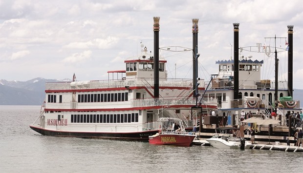 ON BREAK:  The M.S. Dixie II, foreground, is docked between two-hour tours on a late-spring Saturday afternoon at Zephyr Cove, on the southeast side of Lake Tahoe. To its right is the Tahoe Queen, a smaller and older vessel that lately has been sidelined by repair and renovation work.