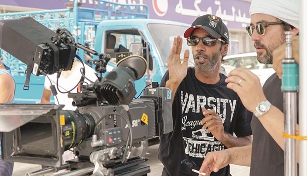 AT THE HELM:  Director Saeed Salmeen al-Murry, left, on the sets of Going to Heaven.