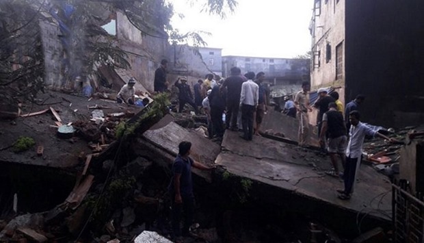 People search the collapsed building for survivors. Picture courtesy: ANI