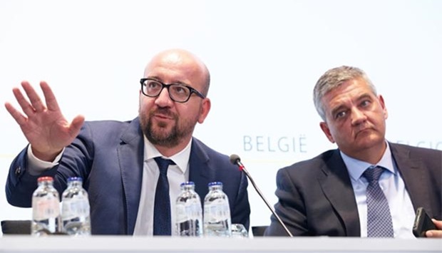 Belgian Prime Minister Charles Michel (left) and Minister of Defence and Public Service Steven Vandeput address a press conference after a special security meeting in Brussels on Sunday, a day after a machete-wielding man wounded two policewomen in Charleroi before being shot dead.