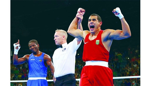 Michel Borges of Brazil celebrates after winning his 81kg preliminary round bout against Hassan Nu2019Dam Nu2019Jikam of Cameroon in the Rio Olympics boxing competition. (Reuters)