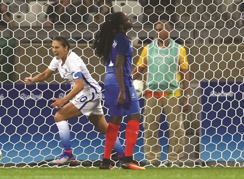 Carli Lloyd (left) of the USA celebrates after scoring a goal against France in their womenu2019s first round Group G football match in Belo Horizonte, Brazil, on Saturday. (Reuters)