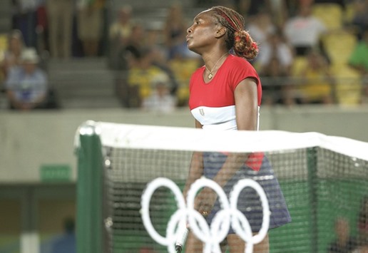 Venus Williams of the USA was knocked out of the singles competition by Belgiumu2019s Kirsten Flipkens on Saturday. (Reuters)