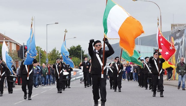 Republicans march in an anti-internment parade, marching from the Falls road, before the parade was stopped by police at the outskirts of Belfast city centre.