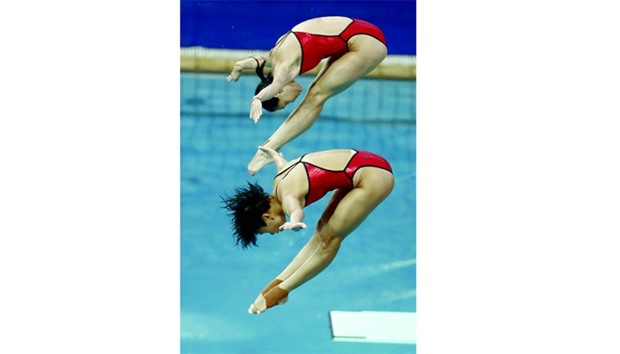 Chinau2019s Wu Minxia and Chinau2019s Shi Tingmao compete in the womenu2019s synchronised 3m springboard final at the Maria Lenk Aquatics Stadium in Rio de Janeiro yesterday.