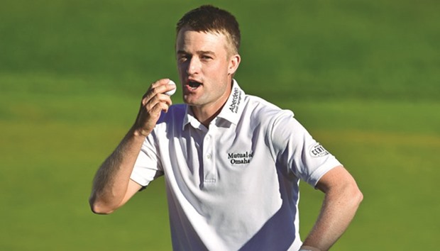 Russell Knox of Scotland kisses the ball after winning the Travelers Championship at TCP River Highlands in Cromwell, Connecticut.