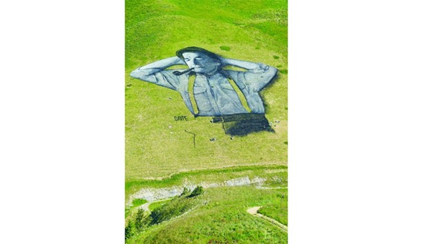 The painting said to be the worldu2019s largest biodegradable painting, is seen on the Chaux-de-Mont ski slope above the Alp resort of Leysin. The 100m long and 100m wide painting is made with flour, linseed oil, water, and biodegradable natural pigments.