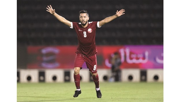 Qataru2019s Rodrigo Tabata celebrates after scoring the opening goal of the match against Iraq yesterday at the Al Sadd stadium.