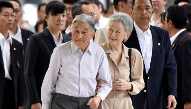Japanese Emperor Akihito (centre L) and Empress Michiko (centre R) upon their departure in Tokyo for the Imperial Villa in Nasu to spend their summer vacation, July 25, 2016.  AFP