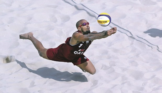 Qataru2019s Jefferson Santos Pereira dives to play a shot during the beach volleyball match against Spain at the Rio 2016 Olympic Games in Rio de Janeiro yesterday.