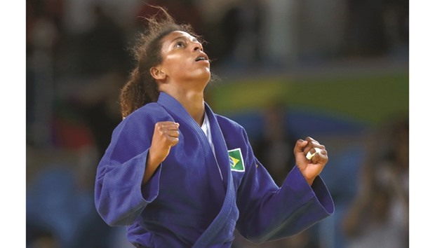 Brazilu2019s Rafaela Silva celebrates after defeating Mongoliau2019s Sumiya Dorjsuren to win the 57kg judo gold medal at the Rio Olympic Games yesterday. (Reuters /Kai Pfaffenbach)