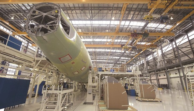 An Airbus A321 is being assembled in the final assembly line hangar at a manufacturing facility in Mobile, Alabama. The companyu2019s shares fell 1% to u20ac50.48 yesterday in Paris after Britainu2019s Serious Fraud Office revealed on Sunday it had opened a criminal probe into the aircraft manufacturer, investigating allegations of fraud, bribery and corruption.