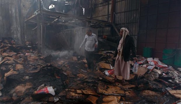 Employees check damage to the Al-Aqel food factory in Sanaa after it was hit by a Saudi-led coalition strike on Tuesday.