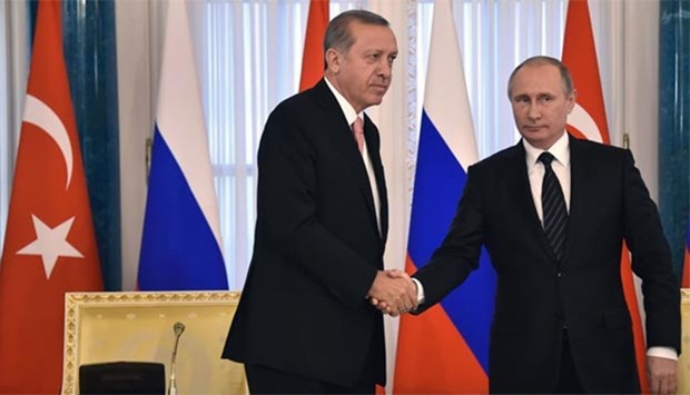Russian President Vladimir Putin shakes hands with his Turkish counterpart Recep Tayyip Erdogan during their press conference in Konstantinovsky Palace outside Saint Petersburg on Tuesday.