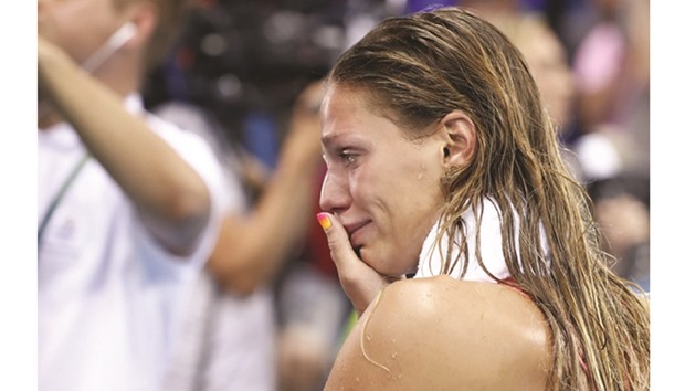Russian swimmer Yulia Efimova cries after finishing second in 100m breaststroke