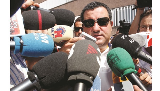 Soccer agent Mino Raiola speaks to the media as he arrives at FC Barcelonau2019s office in Barcelona.