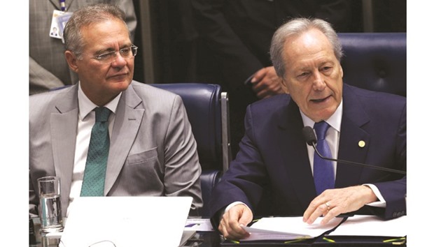 President of Brazilu2019s Supreme Court, Ricardo Lewandowski (right) and Senate President Renan Calheiros attend a Senate discussion in Brasilia yesterday.