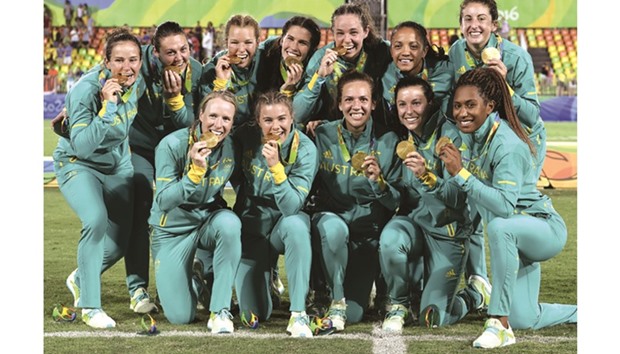 Australian team celebrate after winning womenu2019s rugby sevens gold at the Olympic Games at Deodoro Stadium in Rio de Janeiro on Monday. (AFP / Philippe Lopez)
