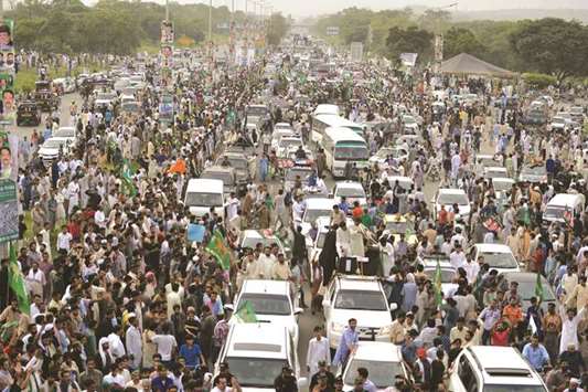 Pakistani supporters escort the vehicle carrying ousted prime minister Nawaz Sharif during a rally in Islamabad yesterday.