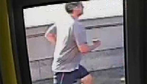 A CCTV image, received via the Metropolitan Police, shows a male jogger on Putney Bridge, in London.