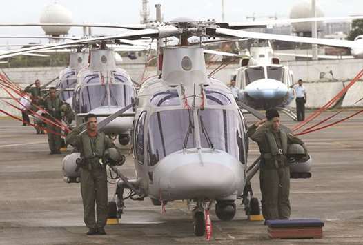 Air Force pilots with newly acquired AgustaWestland AW109E helicopters at the Villamor Air Base in Pasay city, metro Manila.