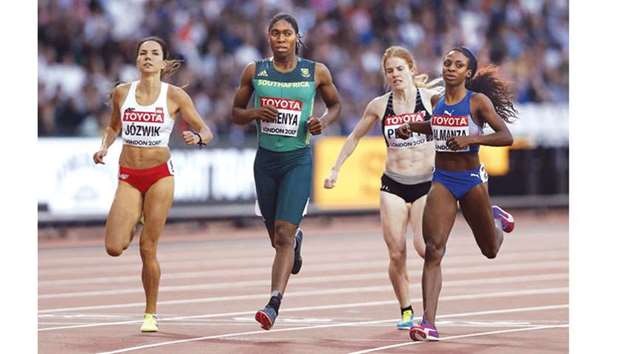(From left) Polandu2019s Joanna Jozwik, South Africau2019s Caster Semenya and Cubau2019s Rose Mary Almanza compete in the womenu2019s 800m heat at the IAAF World Championships in London yesterday. (AFP)