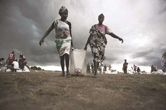 Collecting food aid after an air drop in Leer, Unity State: an increasing number of people are considered acutely food insecure in South Sudan.