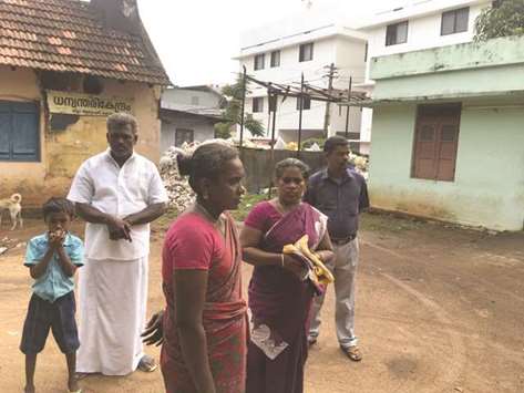 Muruganu2019s family waiting near the mortuary of Government District Hospital, Kollam, for an ambulance to take his body back home.