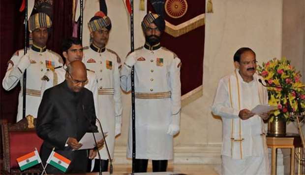 Indian President Ram Nath Kovind administers the oath of office to the new Vice President Venkaiah Naidu during a swearing-in ceremony at the presidential palace in New Delhi on Friday.