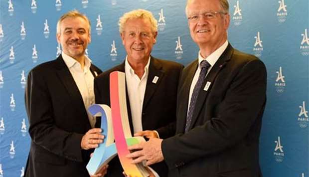 French Director of Paris 2024 Olympic committee Etienne Thobois, International Olympic Committee member Guy Drut, and co-president of Paris bid for 2024, Bernard Lapasset, pose in Paris. Paris is celebrating its victory in its bid to host the 2024 Olympic Games.